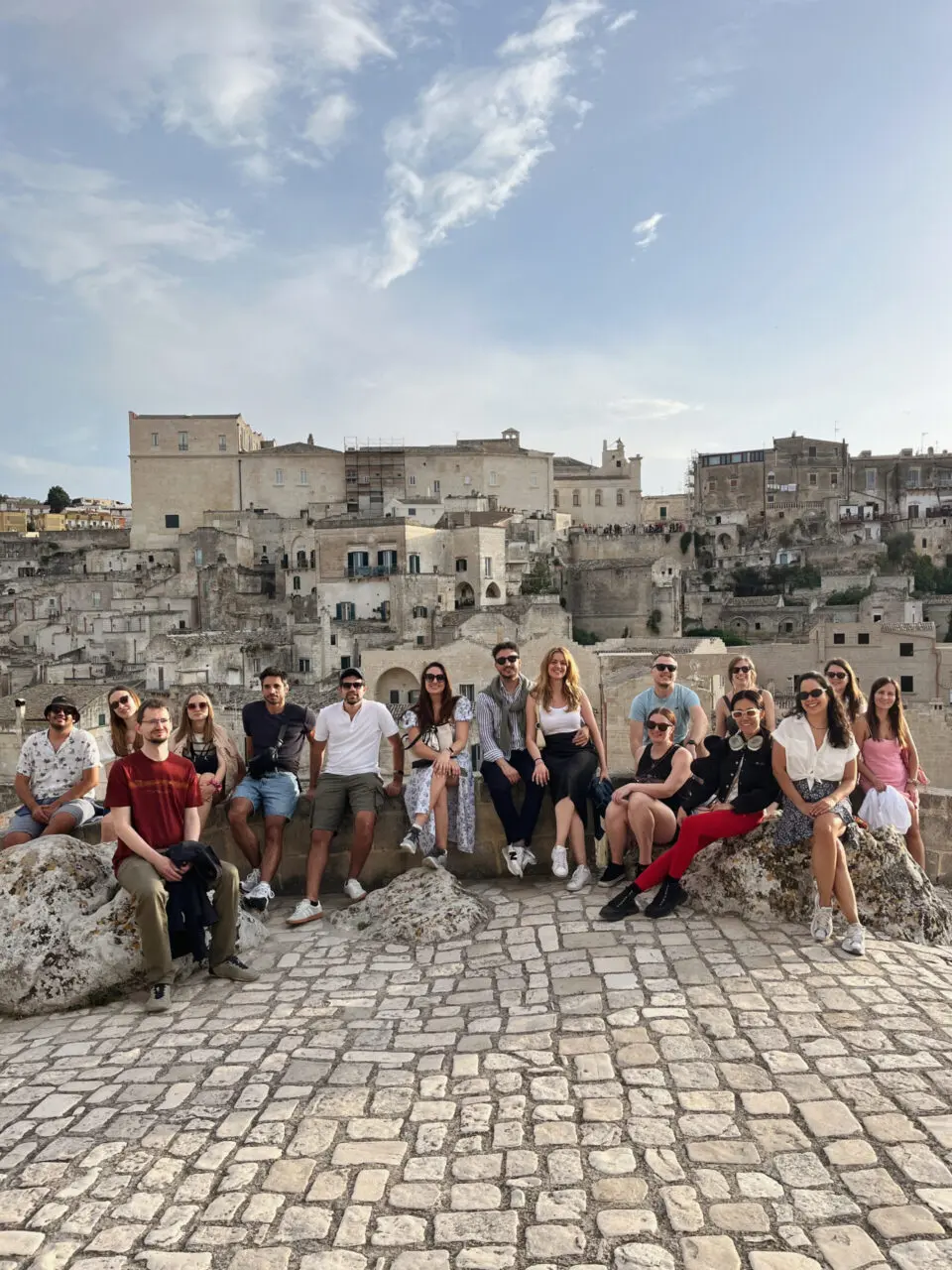 Group photo on a rooftop overlooking the Sassi di Matera cave town